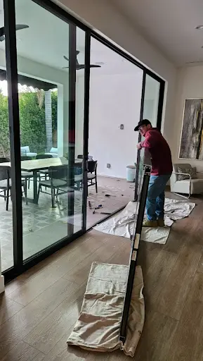 Pocket door installation in progress with floor protection